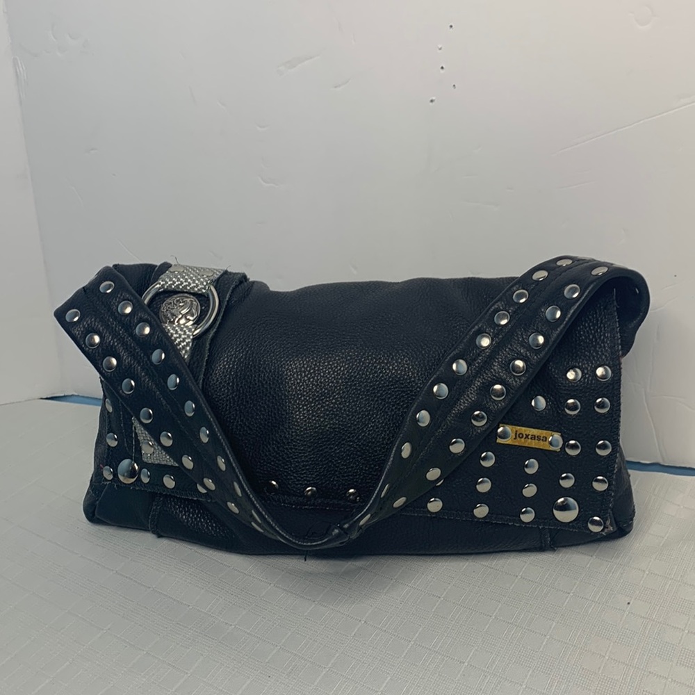 Joxasa handmade leather embellished bag.